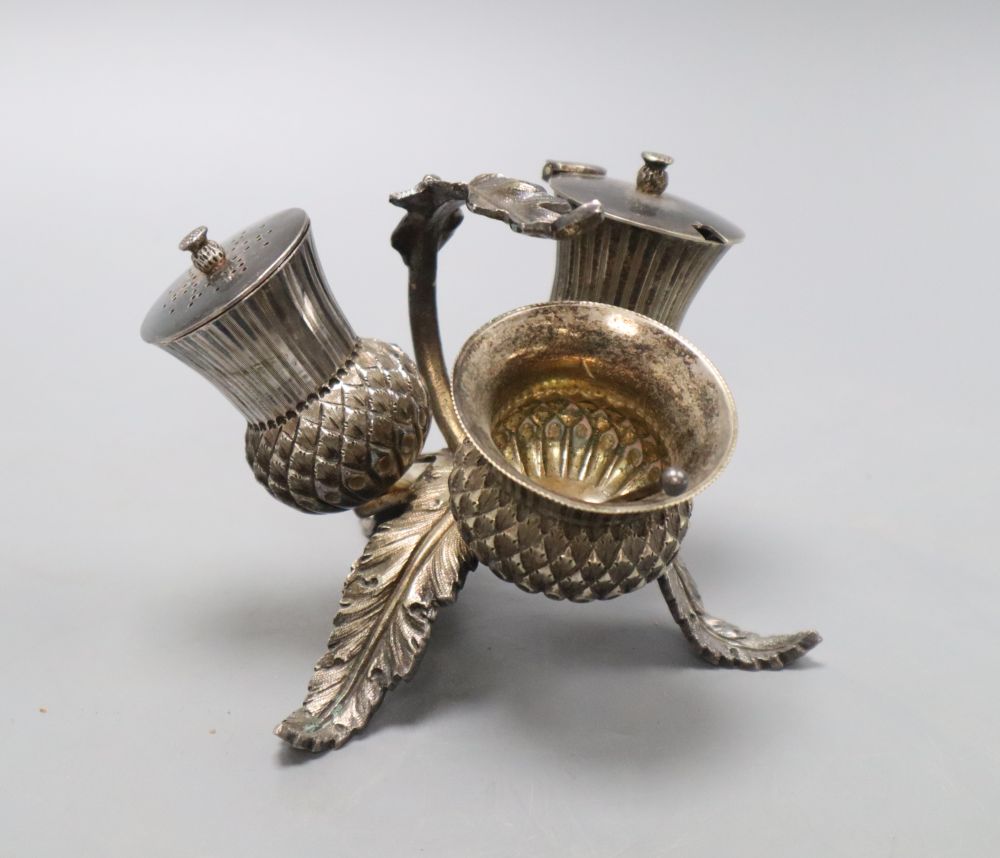 A Victorian electroplate thistle three piece cruet set, height 10cm